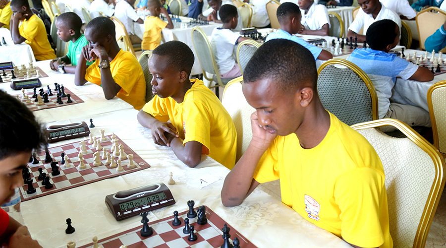 Kagarama SS students doing battle in round 2 of the ongoing 2020 national inter-school chess tournament in Kigali. / Craish Bahizi