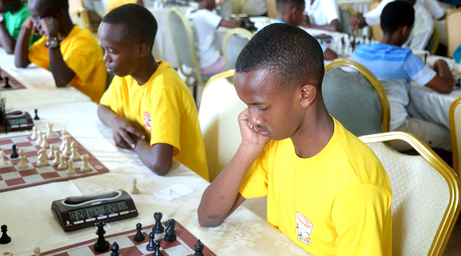 Kagarama SS students doing battle in round 2 of the ongoing 2020 national inter-school chess tournament in Kigali. / Craish Bahizi