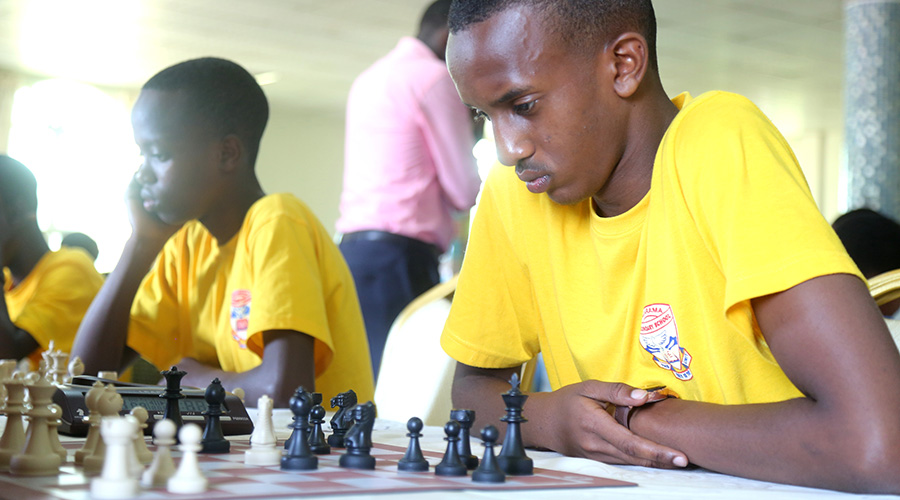 Kagarama SS students doing battle in round 2 of the ongoing 2020 national inter-school chess tournament in Kigali. / Craish Bahizi