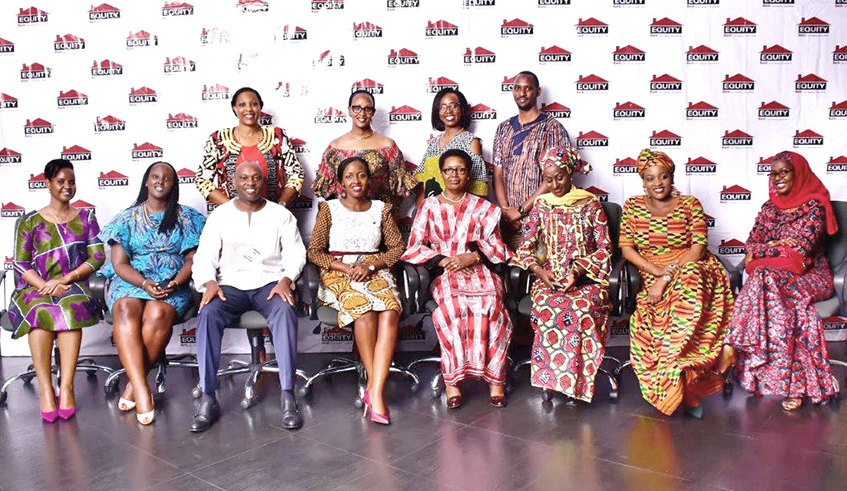 Equity Bank Managing Director, Hannington Namara pose for a group photo during the International Womenu2019s Day celebrations. / All photos Courtesy.