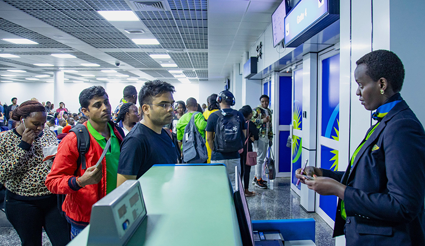 Passengers check in at Kigali International Airport. The new visa regime announced by the Directorate General of Rwanda Immigration and Emigration is expected to boost traffic at the airport. / Photo: File. 