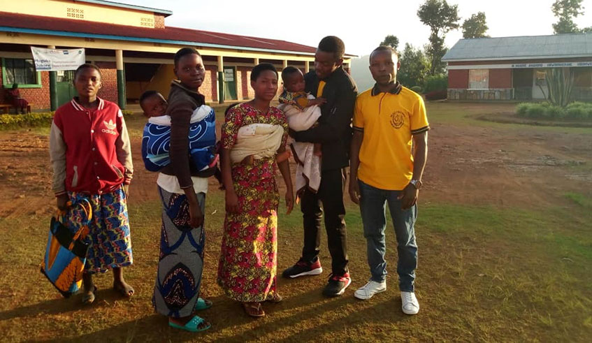 Through his initiative, Ndagimana(2nd right) aims at empowering teen mothers. 