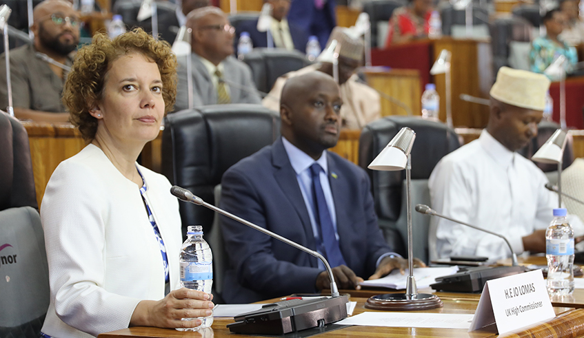 L-R; Jo Lomas, the British High Commissioner to Rwanda; Olivier Nduhungirehe, the Minister of State at the Ministry of Foreign Affairs and Cooperation; and Sheikh Mussa Fazil Harerimana, the Deputy Speaker in charge of Finance and Administration, during celebrations to observe the Commonwealth Day at Parliamentary Building in Kimihurura, Gasabo District on Friday, March 13. / Photo: Craish Bahizi. 