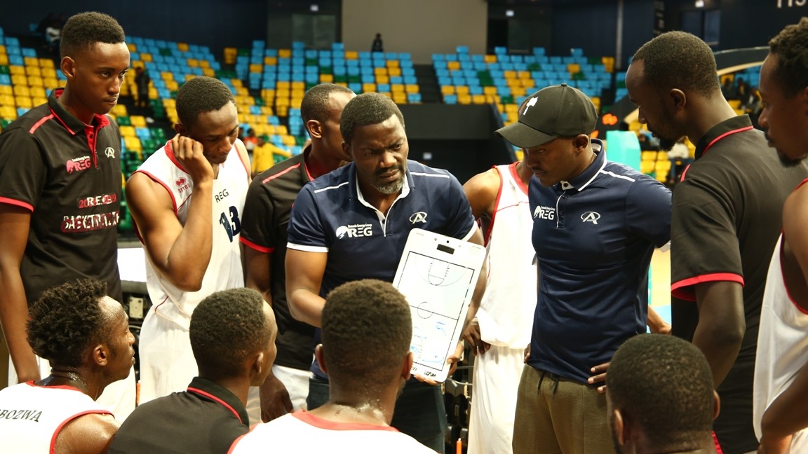 REG head coach, Henry Mwinuka, gives instructions to his players during their 71-52 win over IPRC-Kigali at Kigali Arena on Friday night. 