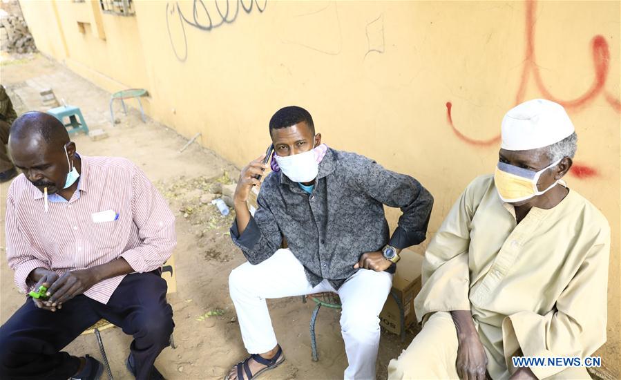 Sudanese people are seen wearing face masks in Khartoum, Sudan, on March 14, 2020. Sudan's Health Ministry on Friday announced the death of a Sudanese citizen infected with COVID-19. 