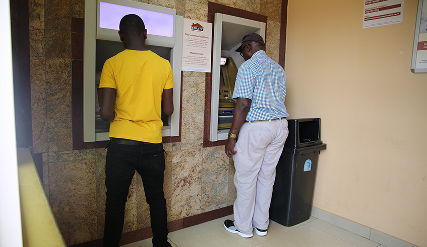 Customer use ATM machines to  withdrawal money in Kigali yesterday. / Craish Bahizi.