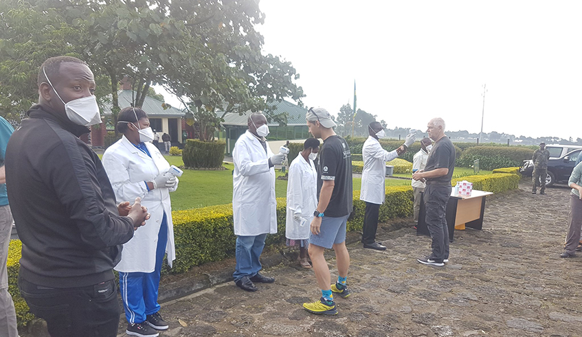 Medics from Ruhengeri Hospital screen tourists before and after they trekk gorillas. / Photo: Courtesy.