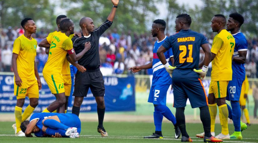 Match officials get into a confrontation with players during a football match. Ferwafa has vowed to punish errant referees. 