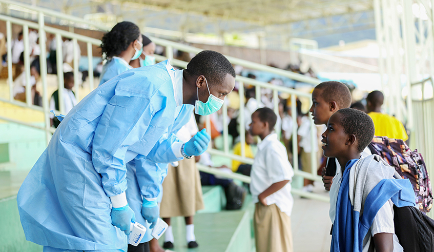Health practitioners screen students at Kigali stadium in Nyamirambo after returning from schools to prevent spread of the coronavirus last week. / Photo: File.
