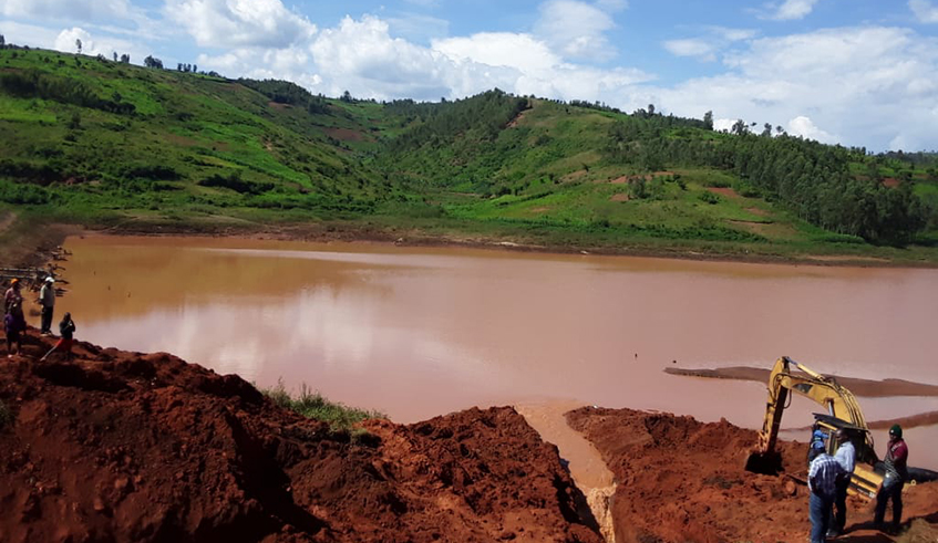 Exclavator works in the ongoing activities to exhume 1994 Genocide against Tutsi victims who were reported to be flown in Ruramira water dam in Kayonza District  (Courtesy)