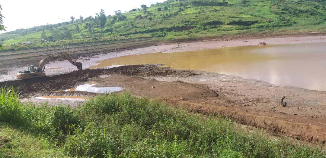 Exclavator works in the ongoing activities to exhume 1994 Genocide against Tutsi victims who were reported to be flown in Ruramira water dam in Kayonza District  (Courtesy)