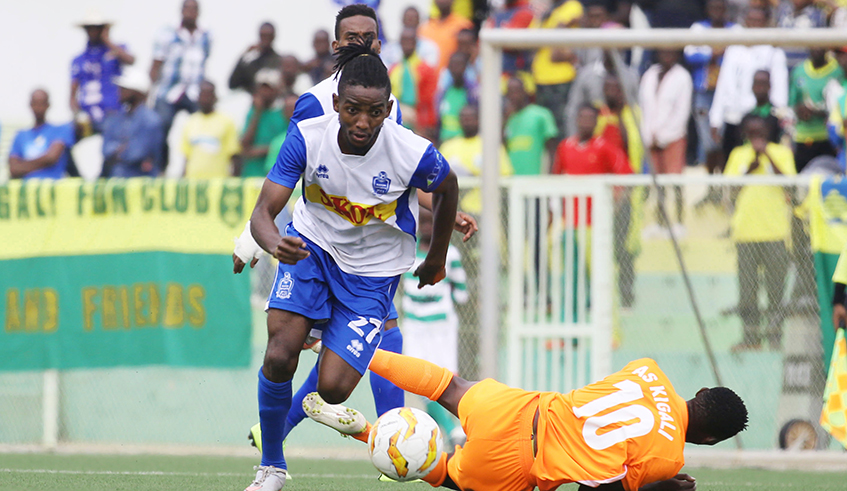 Rayon Sports midfielder Kakure Mugheni Fabrice dribbles past AS Kigali forward during the league match. Kakure is among 6 players whose contracts will end in May. / File photo.