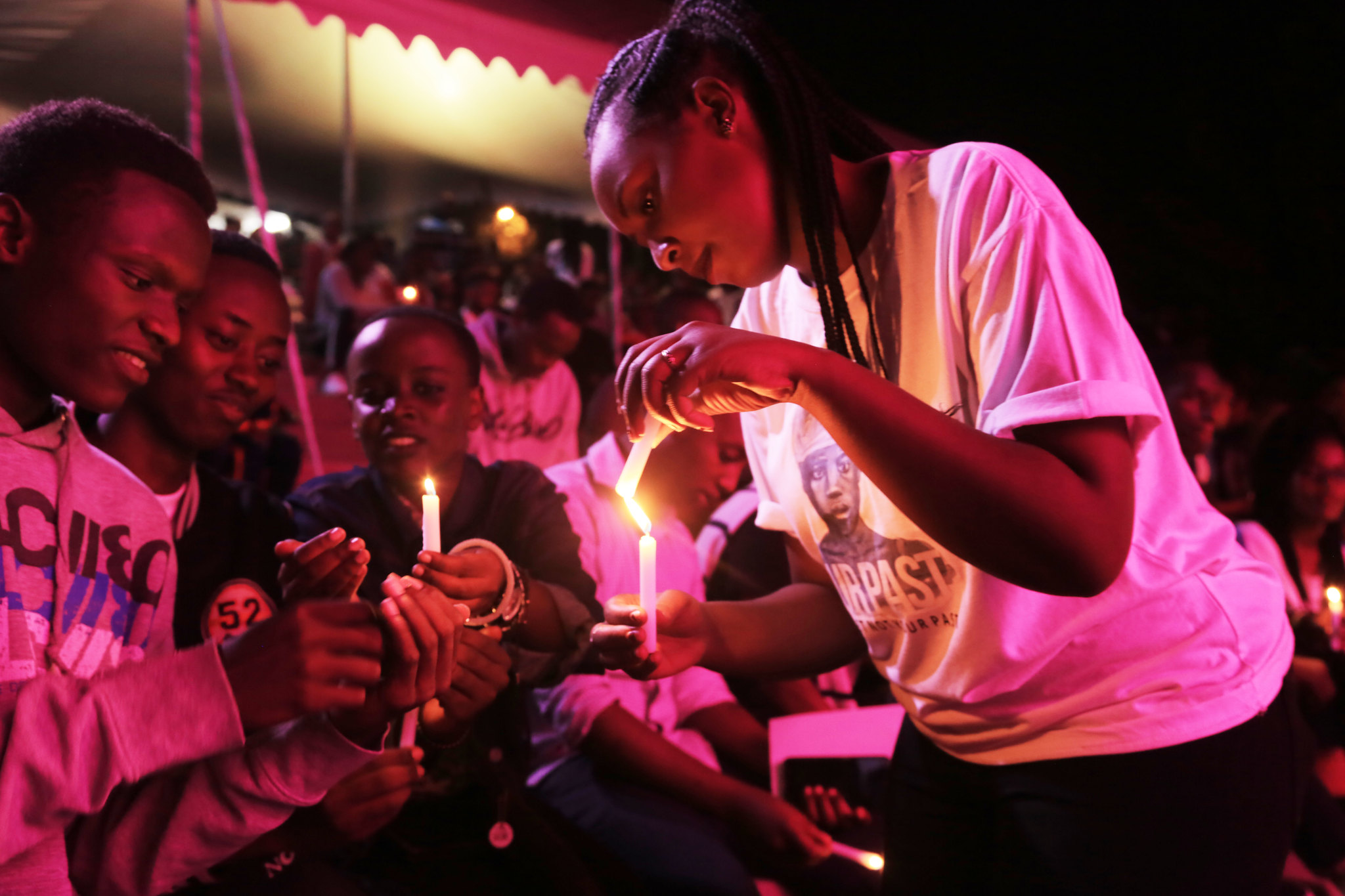 Youth share light of  hope during a night of remembrance  known as 'Our Past' at Kigali Genocide Memorial. 