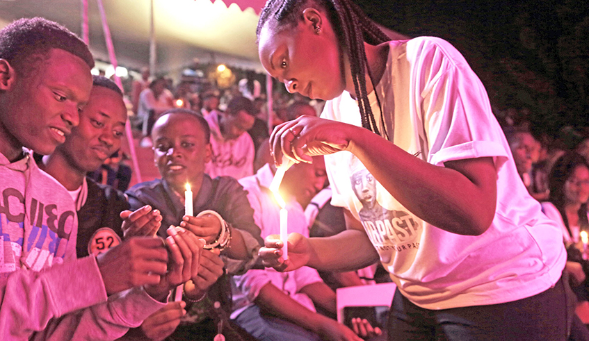 Youths light candles during the commemoration night  dubbed, Our Past, at Kigali Genocide Memorial last year. / Sam Ngendahimana.