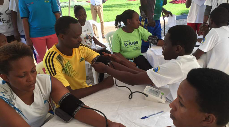 Participants during a previous car-free day routine get their blood pressure checked. 