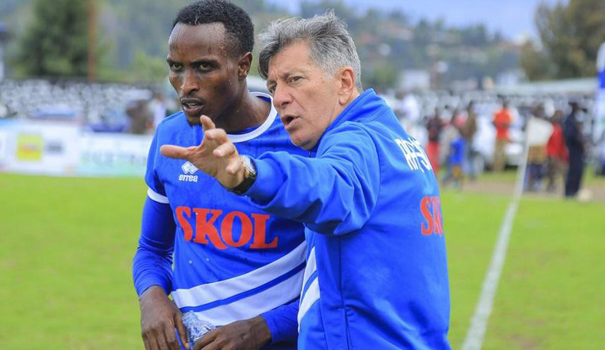 Eric Gisa Irambona, seen here taking instructions from former Rayon Sports coach Roberto Oliveira, is the most senior member of the current squad, having made his senior debut in 2013. / File