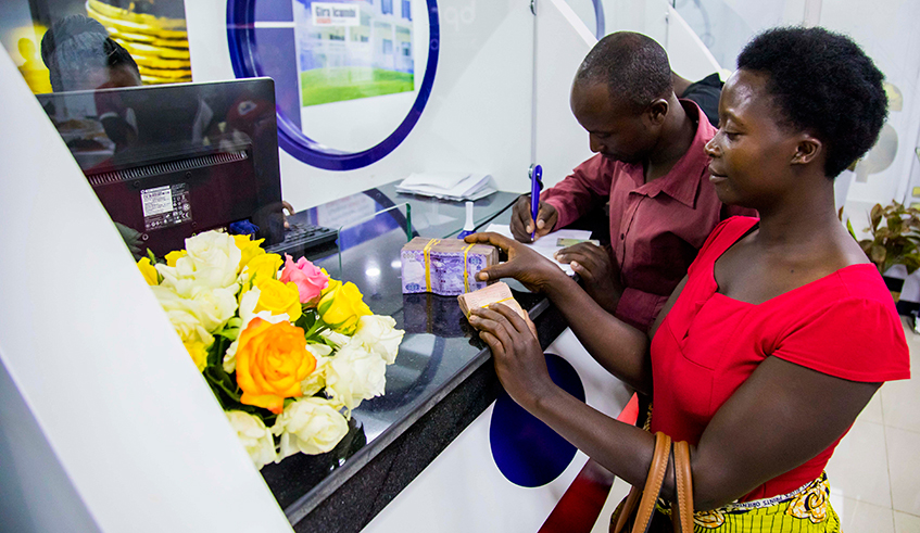 Banque Populaire du Rwandau2019s customers during their transaction at Nyabugogo branch in January. / Sam Ngendahimana.
