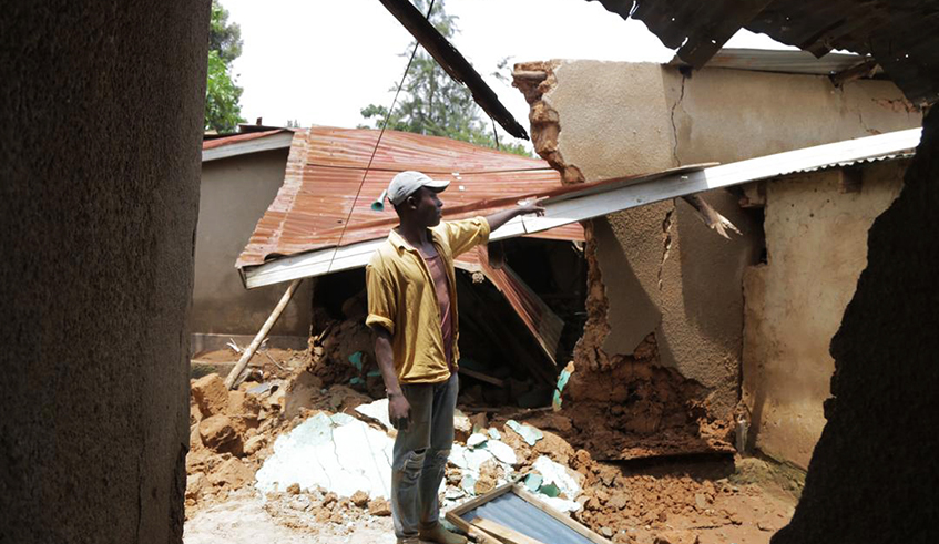 Janvier Musonera at what is left of his family home in the Kigali suburb of Kimisagara, on Friday, April 17. He is one of several residents whose homes were destroyed by heavy rains that battered the city and other parts of the country on Thursday night. The downpour also destroyed roads, bridges, among others. / Photo: Gad Nshimiyimana.