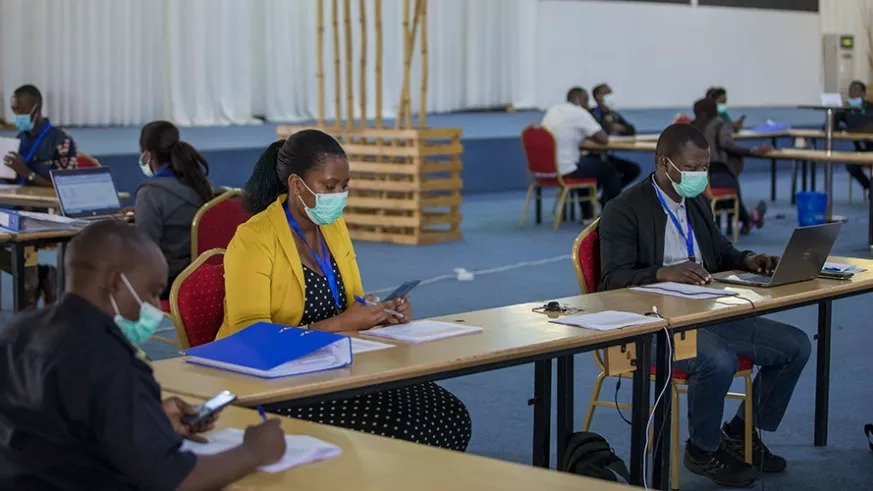 A cross-section of members of the COVID-19 taskforce at work at the Command Post at Kigali Conference and Exhibition Village in Nyarugenge District. They are leading the countryu2019s response to coronavirus. 