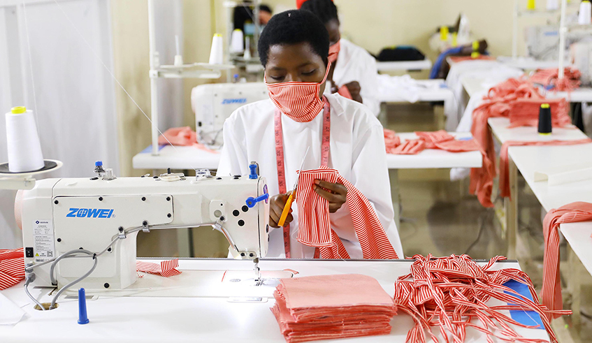 Workers make facemasks at Apparel Manufacturing Group Ltd in Kigali last week. Rwanda Standards Board has urged mask producers to observe minimum standards. / Photo: Olivier Mugwiza.