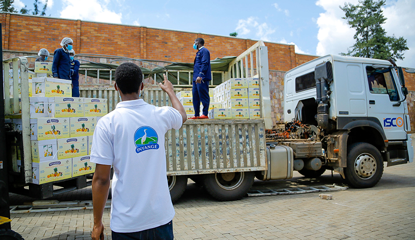 Employees of Inyange Industries load cartons of assorted juice products that were donated by the company towards COVID-19 relief. This is in addition to the Rwf200 million staff members and CVL Group, in general, have contributed towards the same cause. / Courtesy photos