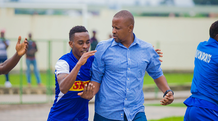 Rayon Sports captain Eric Rutanga (L) and head coach Andru00e9 Casa Mbungo. Belgian Brewery Skol have been the club's main sponsors since 2014. 