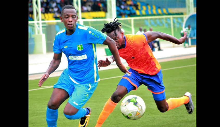 Right-back Michael Rusheshangoga (L), seen here vying for the ball in a past match against Tanzanian side KMC in Caf Confederation Cup, joined AS Kigali from local rivals at the end of last season. / Courtesy photo.