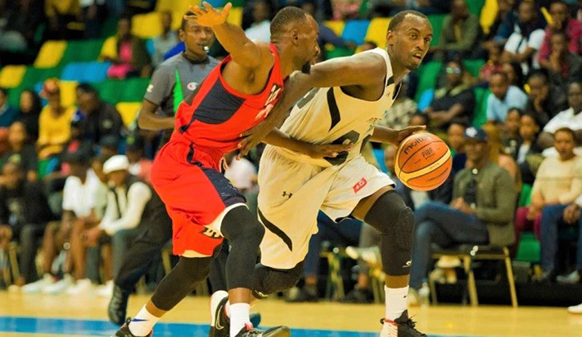 As has been the case for the last five years, champions Patriots and rivals REG again seem to be in a two-horse race for the Basketball National League title. Here, REG skipper Ali Kazingufu Kubwimana (L) is seen trying to guard against his Patriots counterpart Aristide Mugabe in a past game at Kigali Arena. / File
