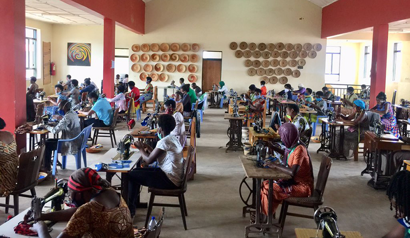 Women tailors producing protective cloth masks for general public use in Rwanda. 