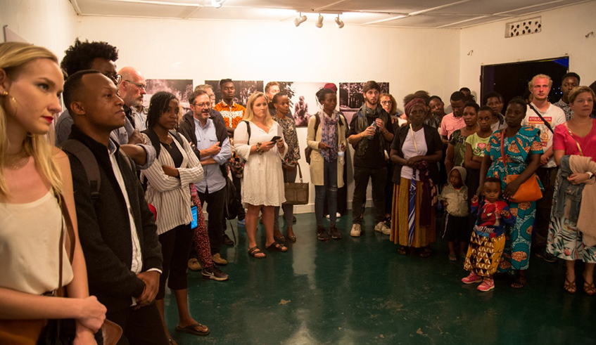 People attend to Murinziu2019s photography exhibition that was held in February, 2020./ Courtesy photo.