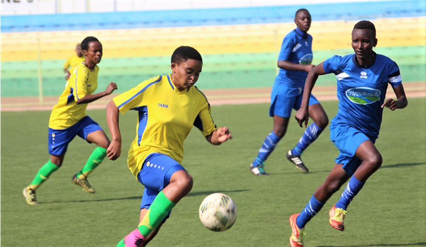AS Kigali striker Callixte Iradukunda (with the ball) is seen here during a past league match against her former side Kamonyi at Kigali Stadium./ Courtesy