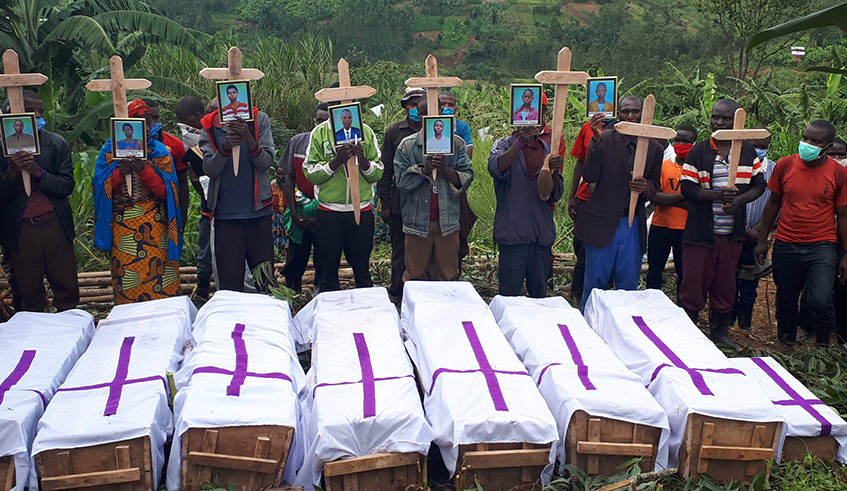 Mourners in Rusasa Sector, Gakenke District at the funeral of eight members of a family killed when a landslide buried their house during the heavy rain that pounded Northern and Western provinces in the wee hours of Thursday morning. The victims u2013 six children and their parents u2013 were buried on Friday, May 8. According to the Ministry of Emergency Management, the downpour triggered landslides and floods that killed at least 72 people. / Photo: Courtesy
