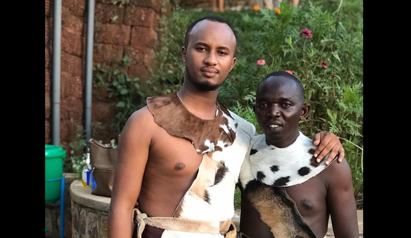 Ibrahim Cyusa with Charles Ntirenganya, one of his Inkera troupe mem-bers. / Courtesy.