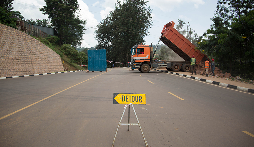 A sign post deviating motorists from the Kanogo-Rugunga road that has been closed off for repairs. Police said the road will be closed until May 21. / Photo: Dan Nsengiyumva.