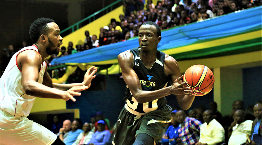 Chris Walter Nkurunziza (L), of Rwanda Energy Group (REG), defends against Patriots basketball club's Dieudonnu00e9 Ndizeye during a past game at Amahoro Indoor Stadium. The two sides have won league titles of the last four seasons between them, with Patriots taking home three, while REG were the 2016-17 champions. 