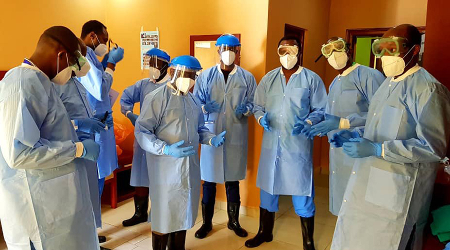 Front-line workers pose for a group photo at Kanyinya COVID-19 treatment facility on 14 April 2020. 