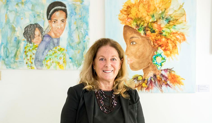 Cindi Cassady with some of her paintings exhibited for the  ongoing Womenâ€™s arts exhibition.