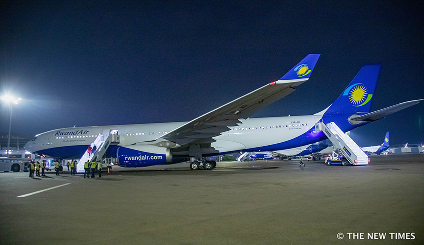 Passengers board a RwandAir plane at Kigali International Airport on June 19, 2019. The International Air Transport Association (IATA) has issued a series of recommendations which could help the aviation sector as it plans to re-start passenger flights amid the COVID-19 crisis. / Photo: File