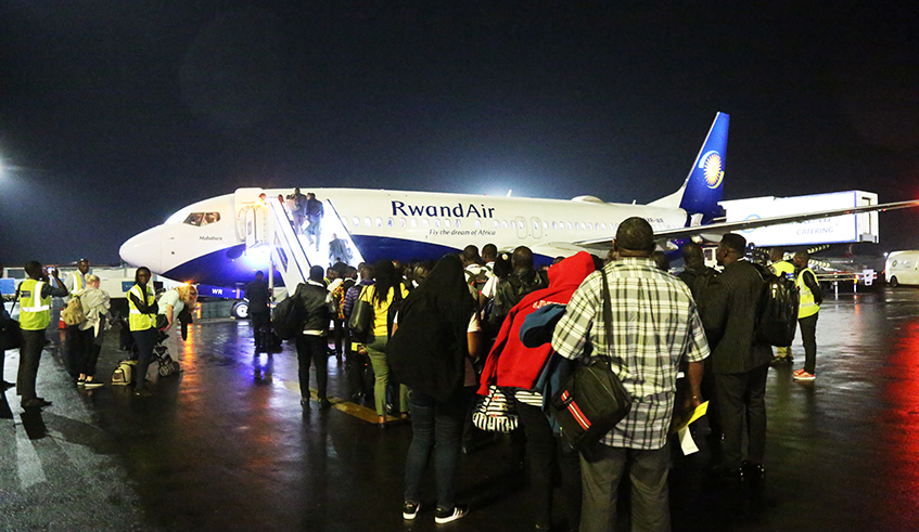 Passengers board a RwandAir flight at Kigali International Airport on June 18, 2019. / Sam Ngendahimana.