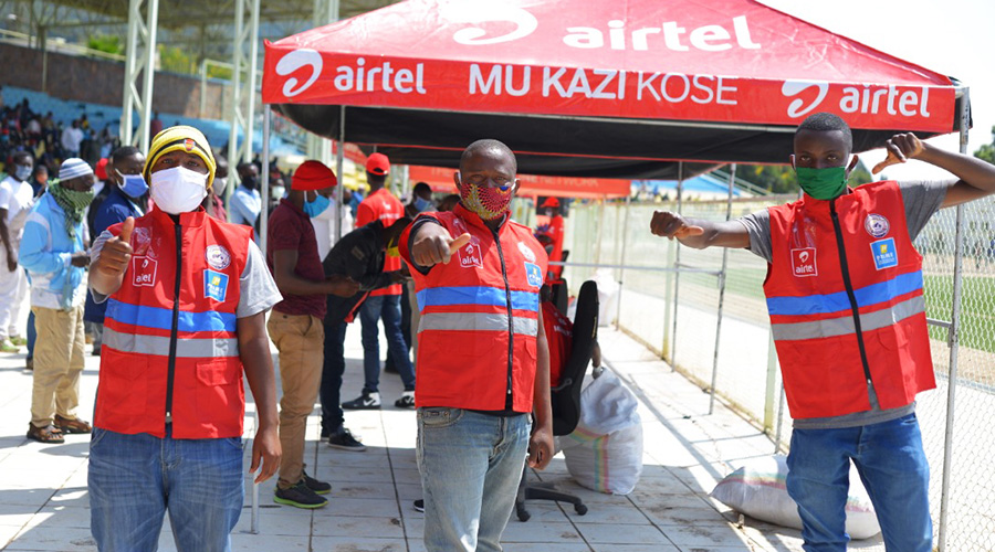 A taxi-moto rider gives a thumbs up gesture after receiving a brand new reflective jacket from Airtel Rwanda.