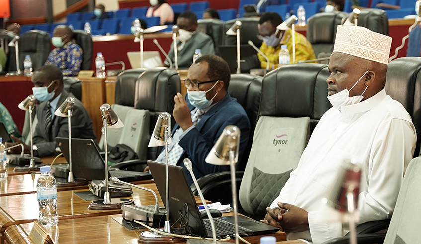 MP Omar Munyaneza (right), the chairperson of the Parliamentary Standing Committee on National Budget and Patrimony during the session. / Craish Bahizi.