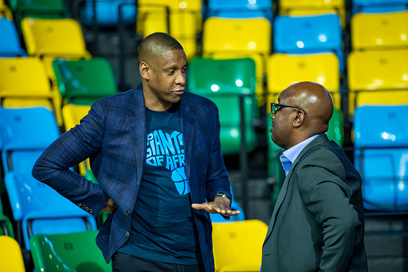 Giants of Africa Co-Founder Masai Ujiri (L) speaks to Desire Mugwiza, President of the Rwanda Basketball Federation, at the launch of the Giants of Africa Festival at Kigali Arena in February this year. File