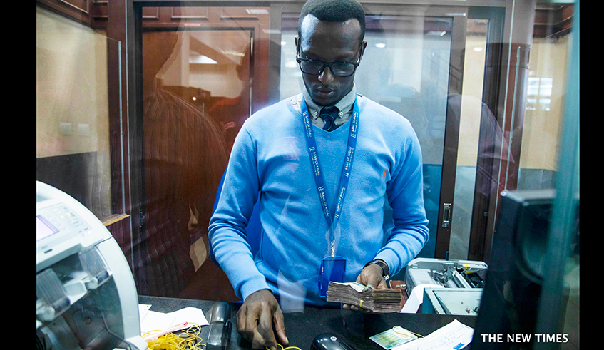 A teller inside Bank of Kigali. / File 