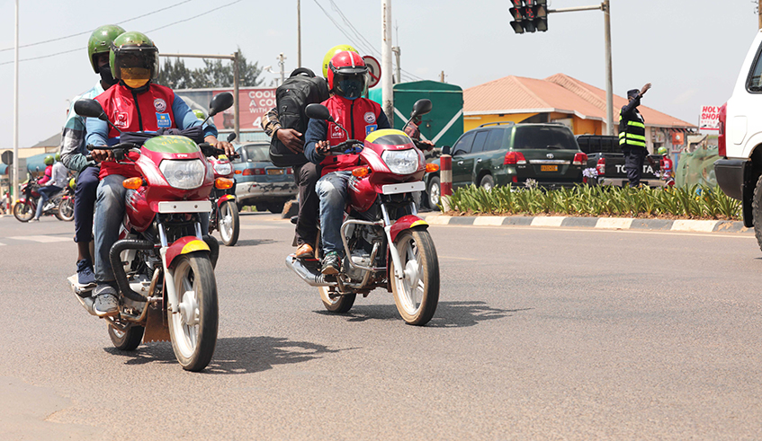 Taxi-moto riders transport passengers in Remera on June 3. / Craish Bahizi.