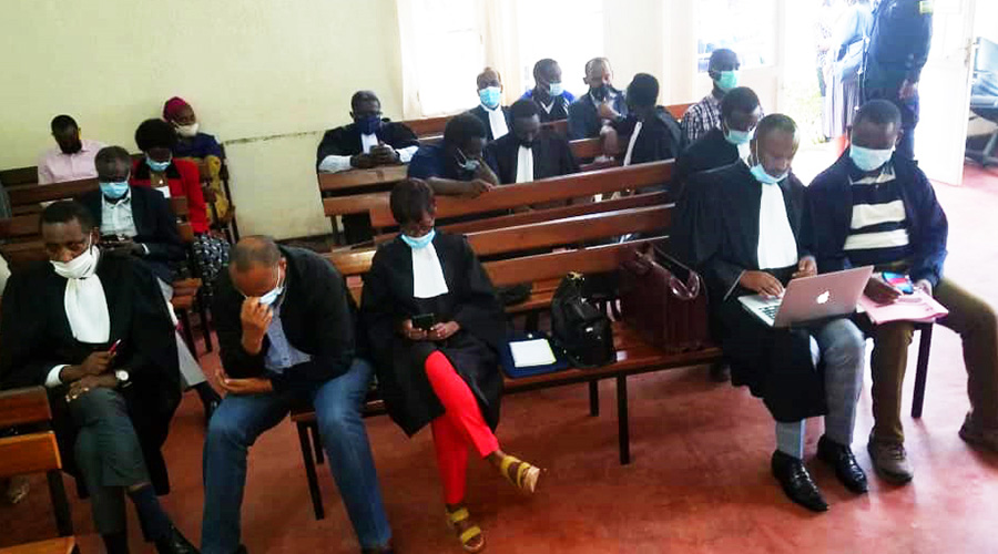 The permanent secretary in the Ministry of Finance and Economic Planning, Caleb Rwamuganza (right) and his co-accused and lawyers inside the Gasabo Primary Court in Kigali yesterday. 