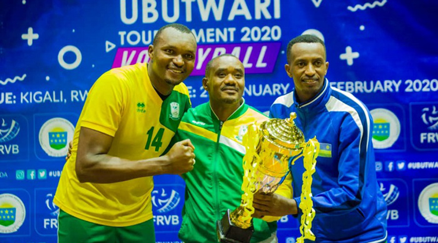 Fidu00e8le Nyirimana (C) celebrates with his players Madison Placide Sibomana (L) and Olivier Ntagengwa after winning this year's Ubutwari Volleyball Tournament in February. 