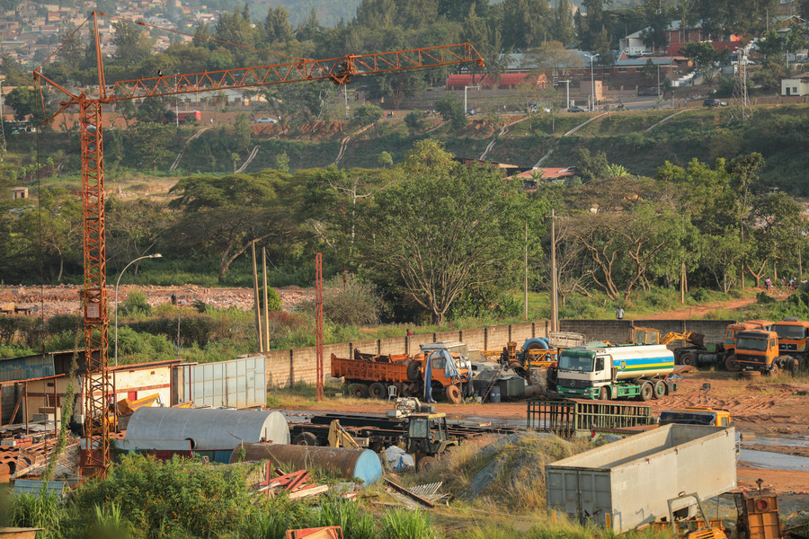 Occupants of former Gikondo industrial park remove their machinery, old cars, heavy steel and other materials remaining in the wetland on Thursday, June 18. The City of Kigali has given them seven days to have cleared the former premises to pave way for the rehabilitation of the wetland. / Photo: Dan Nsengiyumva