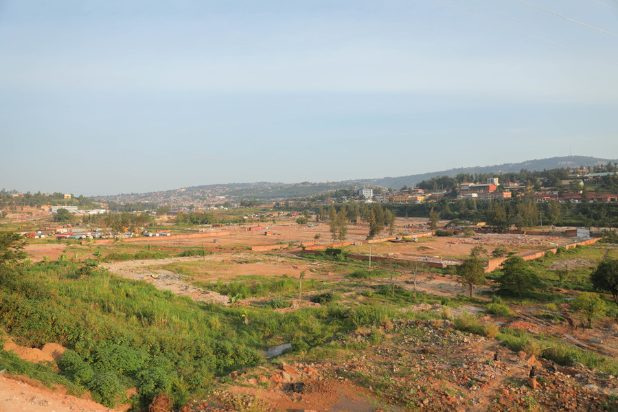 Occupants of former Gikondo industrial park remove their machinery, old cars, heavy steel and other materials remaining in the wetland on Thursday, June 18. The City of Kigali has given them seven days to have cleared the former premises to pave way for the rehabilitation of the wetland. / Photo: Dan Nsengiyumva