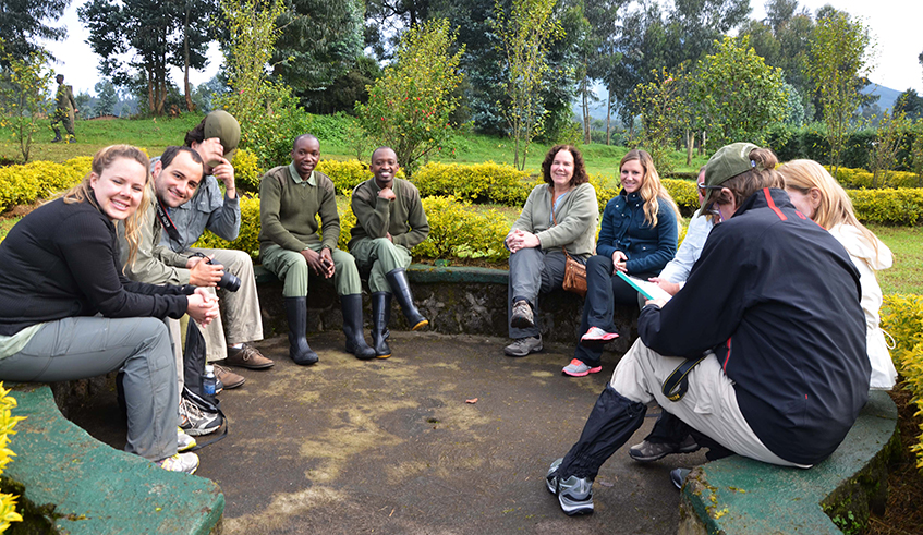 Tourists are briefed before setting off to track mountain gorillas in the Volcanoes National Park in the past. / Sam Ngendahimana. Tourists are briefed before setting off to track mountain gorillas in the Volcanoes National Park in the past. / Sam Ngendahimana.