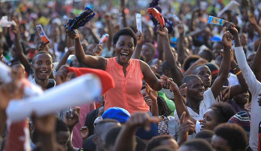 FranÃ§ois Nsengiyumva, aka Igisupusupu and veteran singer Abdul Makanyaga (right) perform at Iwacu Muzika festival  last year, as the excited crowd cheers on. / Courtesy.